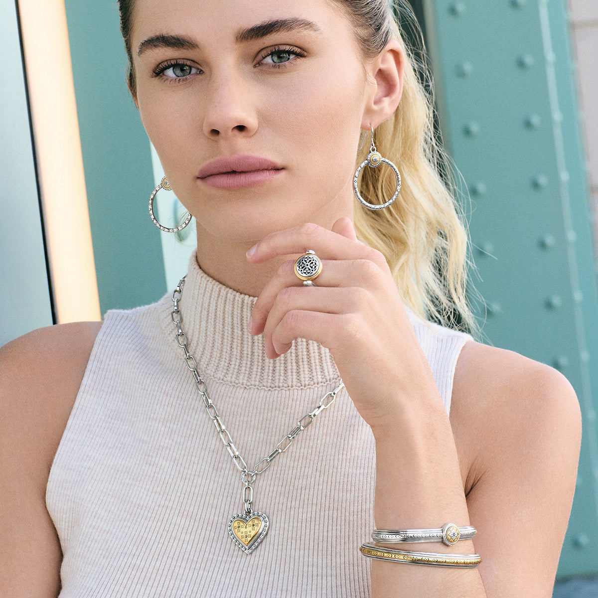 Silver-gold two tone French wire hoop earrings with etched granulation pattern and small round pendant.
