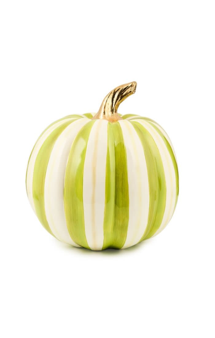 Resin medium pumpkin with bold green stripes on a warm autumn background.