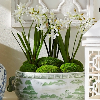 Five-inch green polyethylene moss ball plant decoration sold individually.