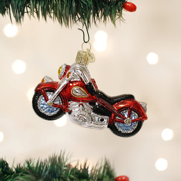 Mouth-blown glass motorcycle ornament with silver interior and colorful lacquer paint.