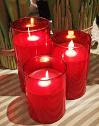 Glass pillar candle with realistic moving flame effect on warm white LED lights