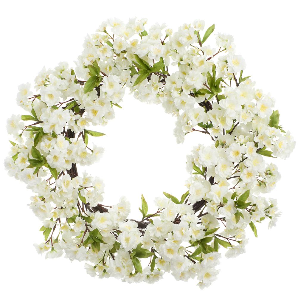 Round cherry blossom wreath with pink floral patterns on a metal wire frame.