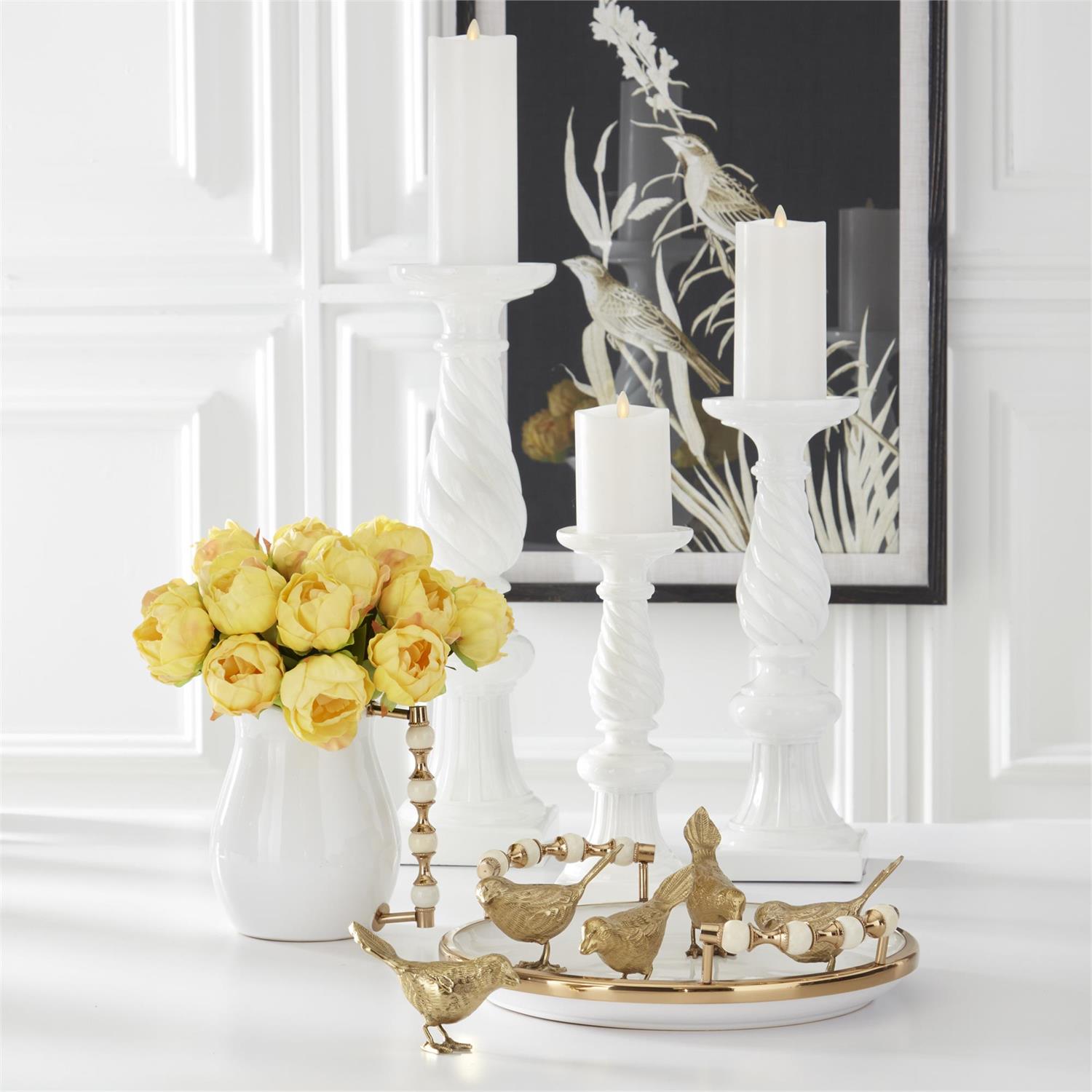Antiqued gold aluminium bird sculpture facing left with a detailed wing pattern.