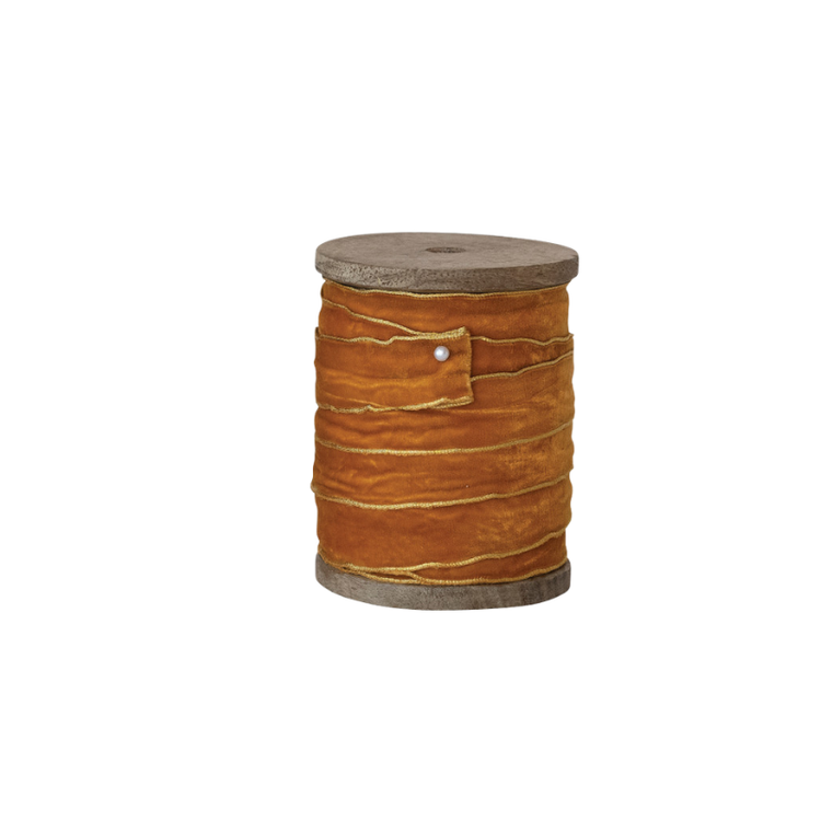 5 yards of 3/4 inch wide mustard velvet ribbon with gold metallic edges on a mango wood spool.