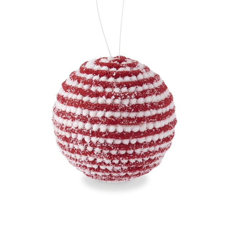 4.75-inch spherical ornament with snowy red and white yarn stripes on a glittered foam fabric surface.