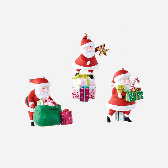 Red resin Santa ornament with white beard and black hat