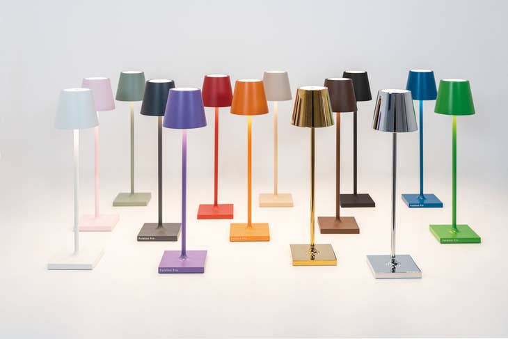 Die-cast aluminum cordless table lamp with polycarbonate diffuser in powder-coated finish featuring touch dimming controls.