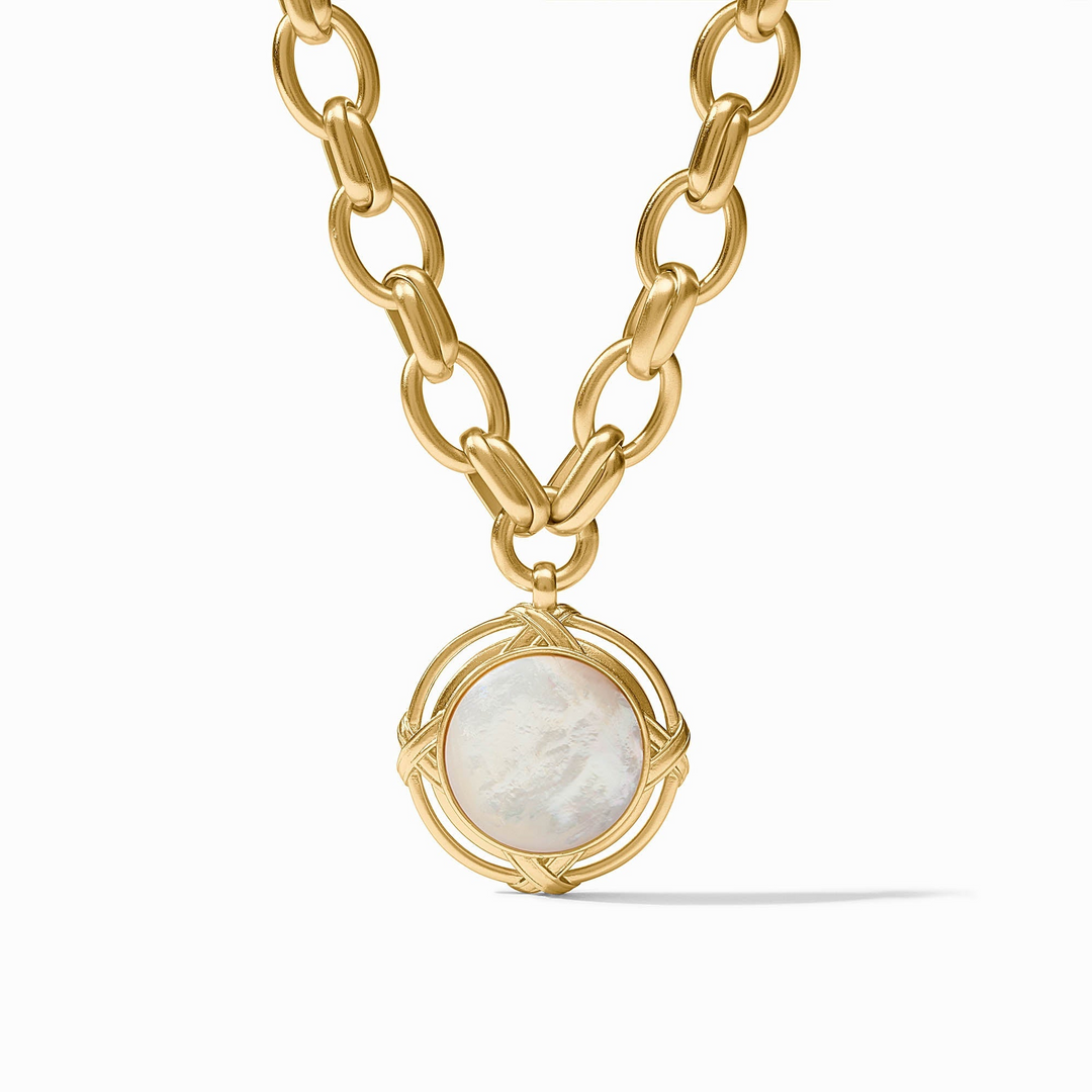 Essex Statement Necklace featuring a gold link chain and a round white mother of pearl pendant.