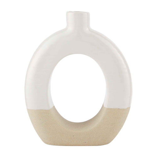 Stoneware cutout vase with a geometric silhouette in neutral tone
