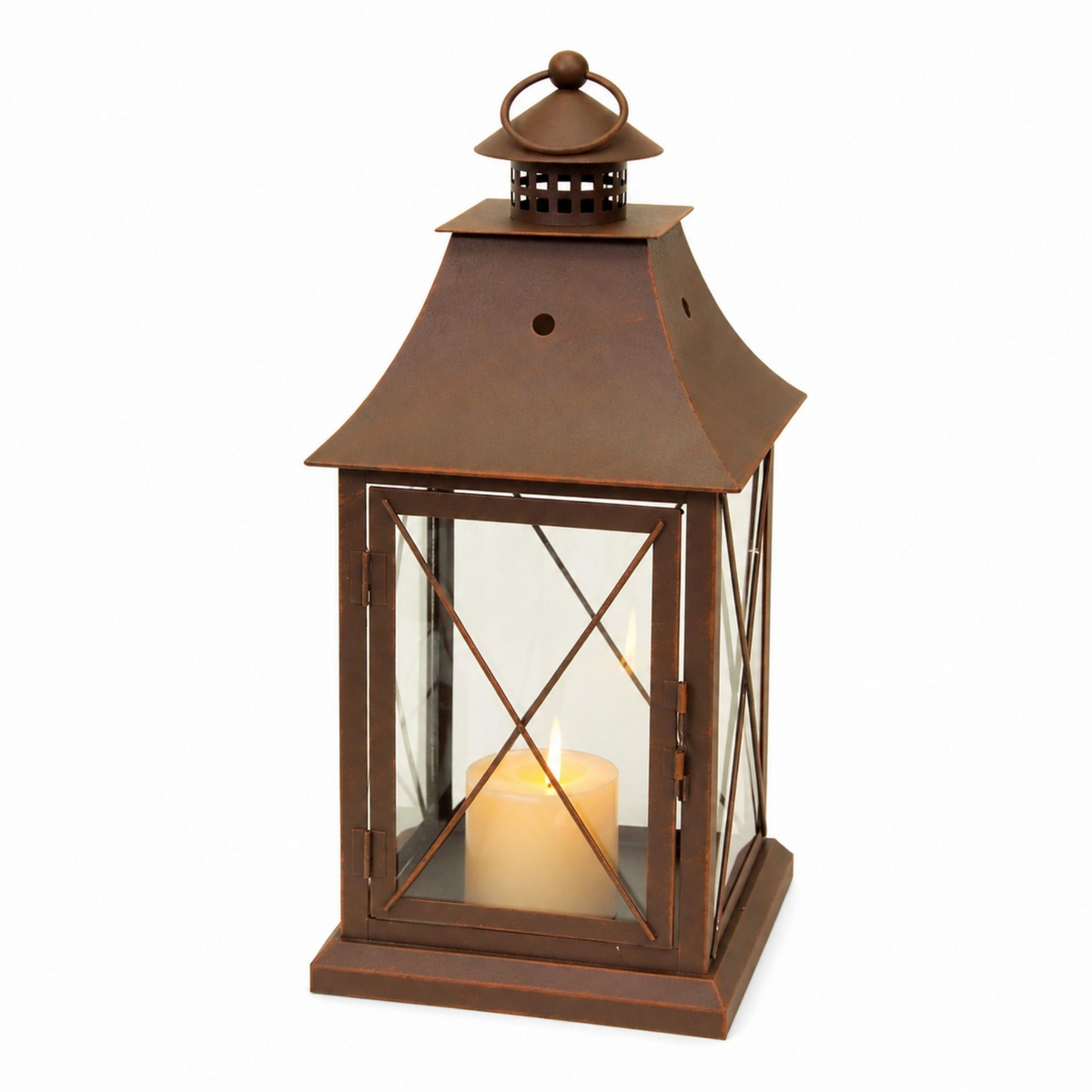 Rustic brown metal lantern with a lit pillar candle inside, featuring a classic X-frame design.