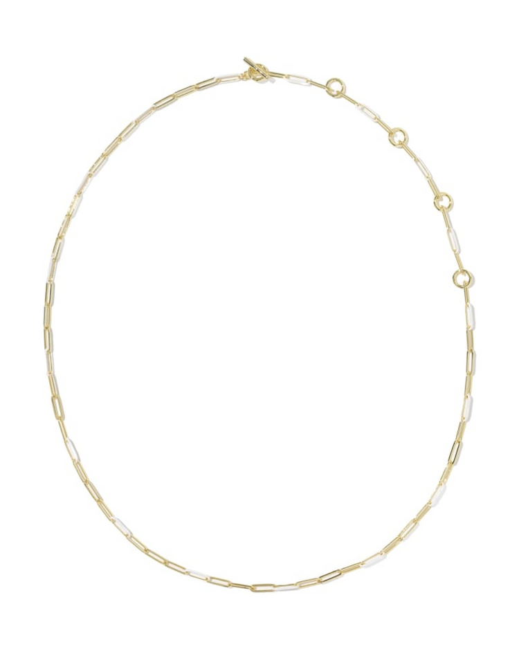 Courtney gold necklace with alternating metal and white enamel paperclip links and toggle closure.