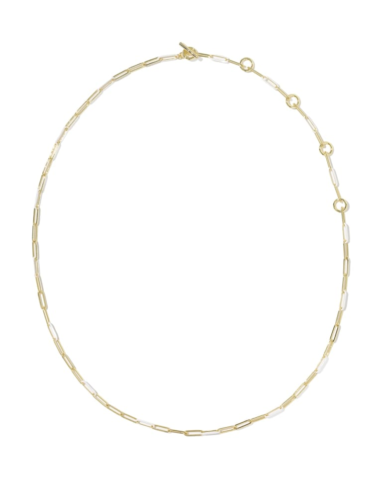 Courtney gold necklace with alternating metal and white enamel paperclip links and toggle closure.
