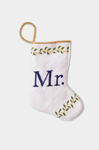 Hand-stitched needlepoint stocking with cotton threads in red velvet backing.
