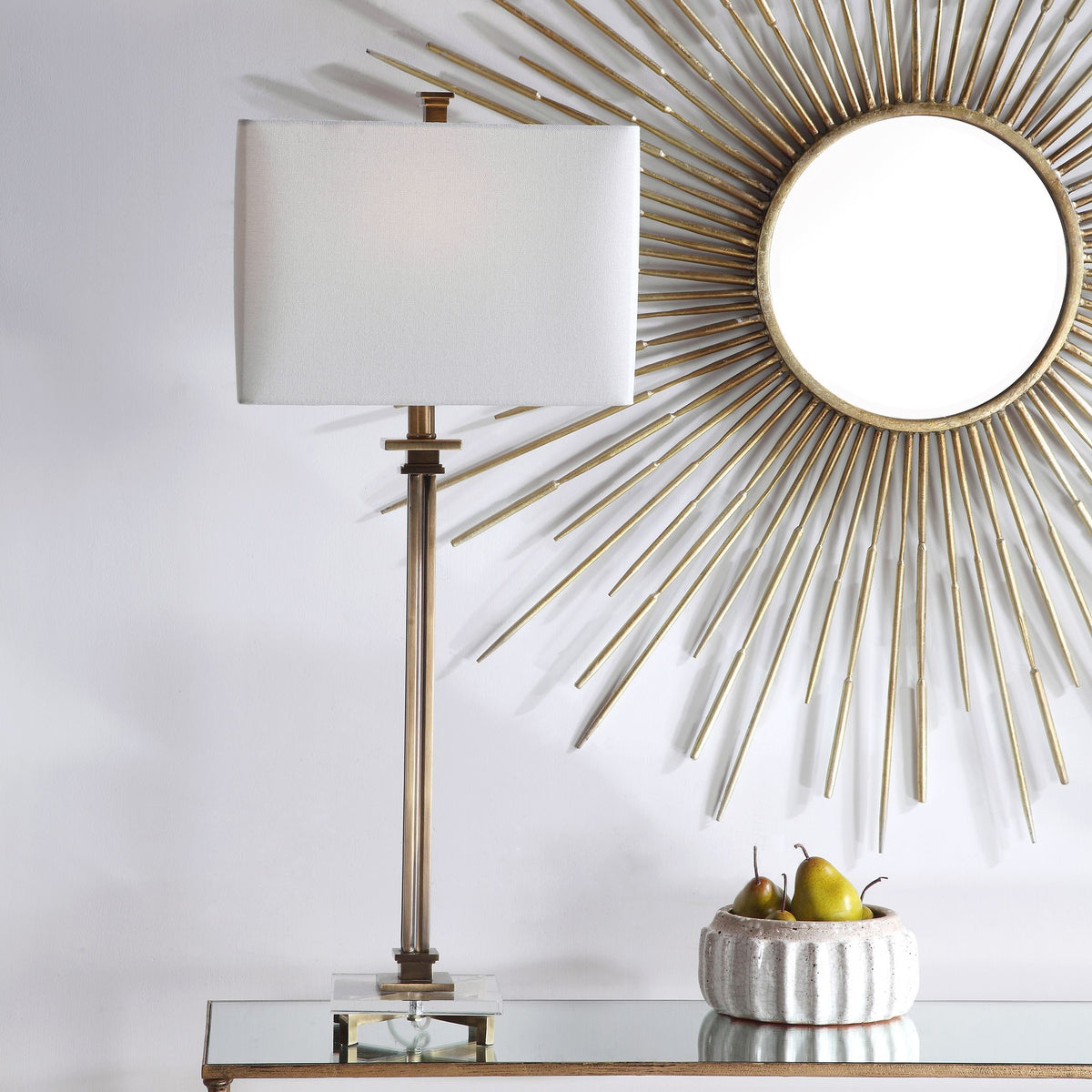 Phillips brass table lamp with fluted metal base, antique brass finish, crystal accent, and white linen rectangular shade.