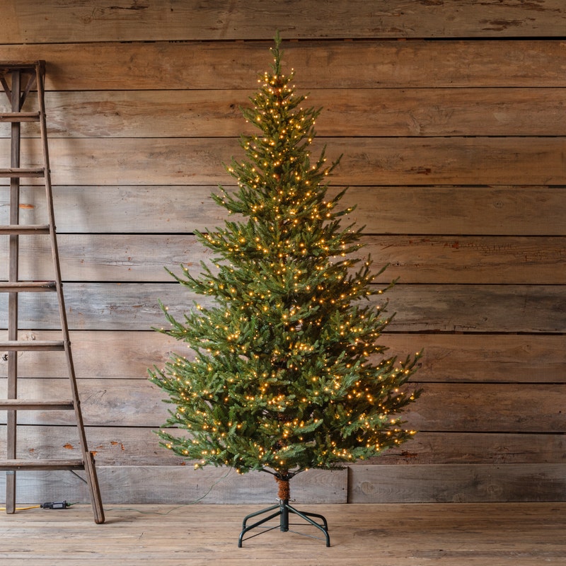 7.5-foot Olympia Fir artificial Christmas tree with 800 clear lights on a metal stand.