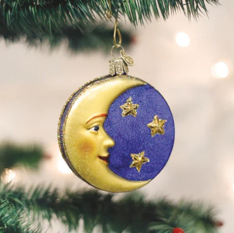Crescent moon face ornament with a silver finish and hanging loop.
