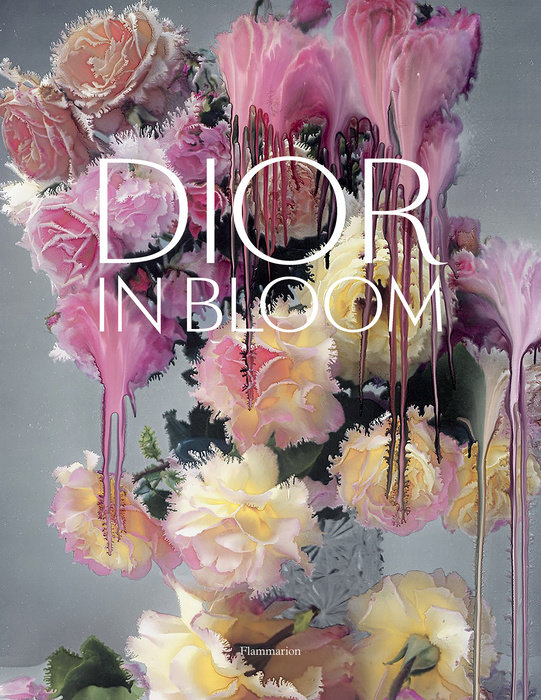 Dior in Bloom book cover featuring pink and yellow roses with artistic paint drips by Nick Knight.