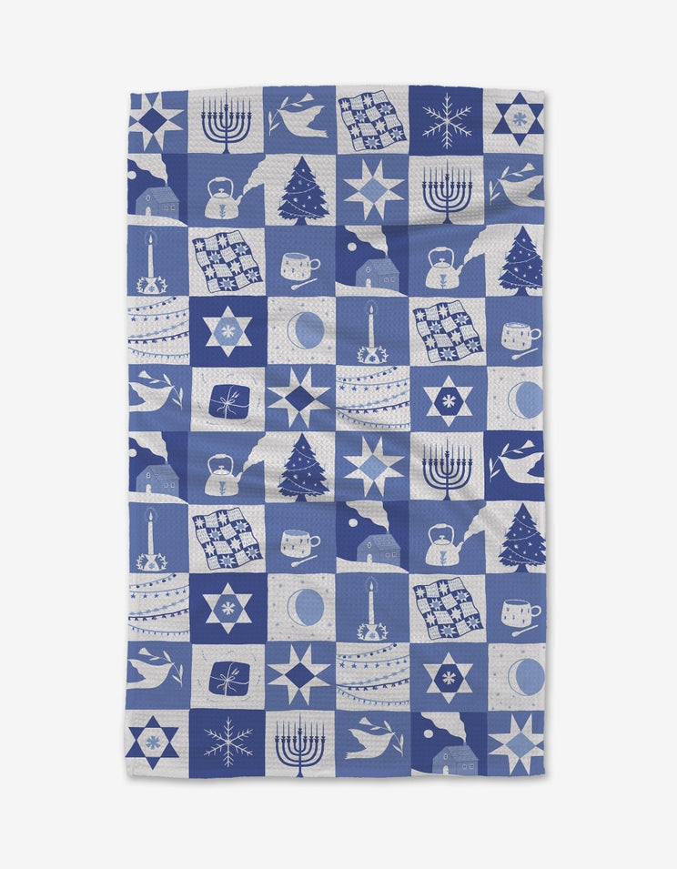Holiday-themed tea towel with waffle weave texture in red featuring festive snowflake pattern.