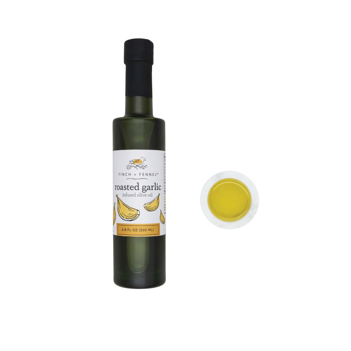 6.8 oz. bottle of Finch + Fennel Roasted Garlic Infused Olive Oil next to a small bowl of oil.