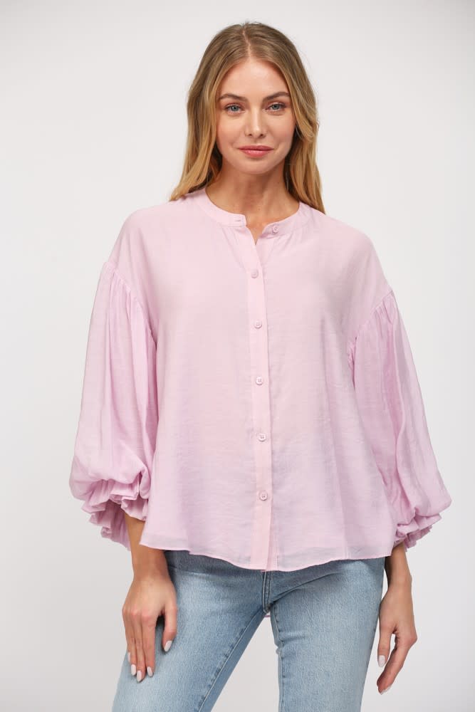 Diana puff sleeve button down shirt in light blue rayon and nylon blend with a relaxed silhouette.