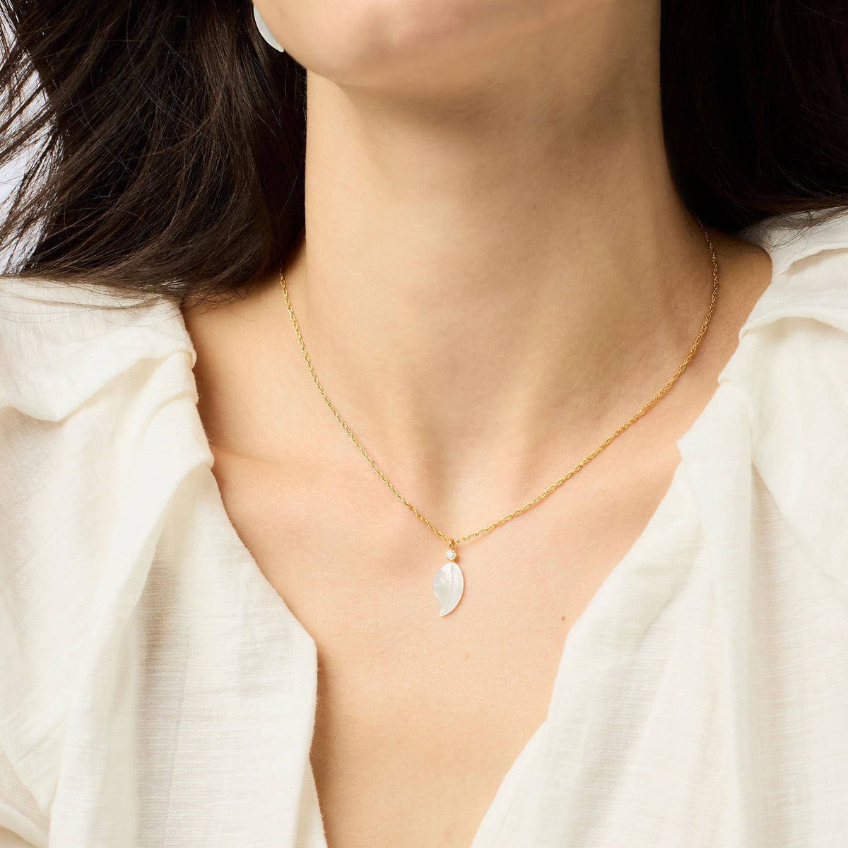 Adjustable Willow necklace with a mother-of-pearl pendant on 24K gold plate chain.