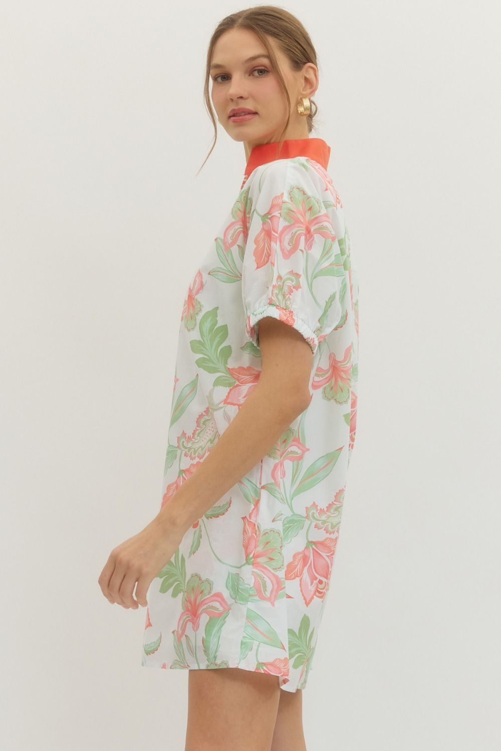 Ella floral print mini dress with puff sleeves, contrast band collar V-neck, side pockets, and lightweight cotton fabric.
