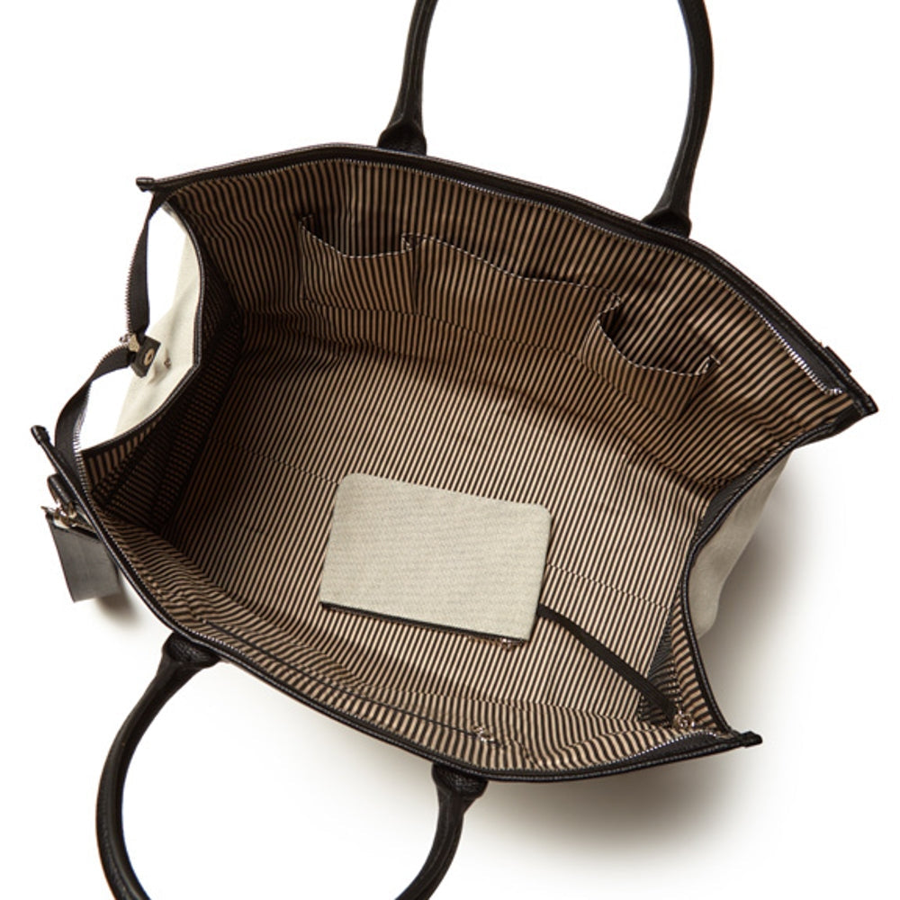Black Capri boarding bag with structured rectangular shape.