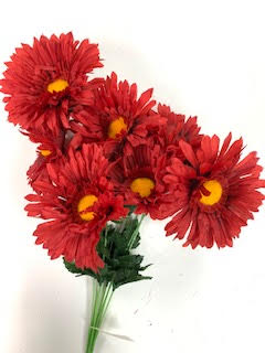 A bouquet of nine red artificial daisy flowers with yellow centers and green stems.