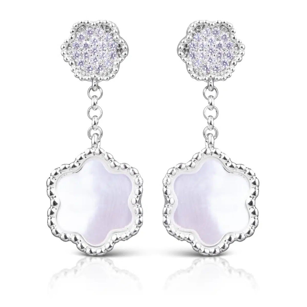 Silver clover drop earrings featuring CZ-encrusted studs and mother of pearl pendants.