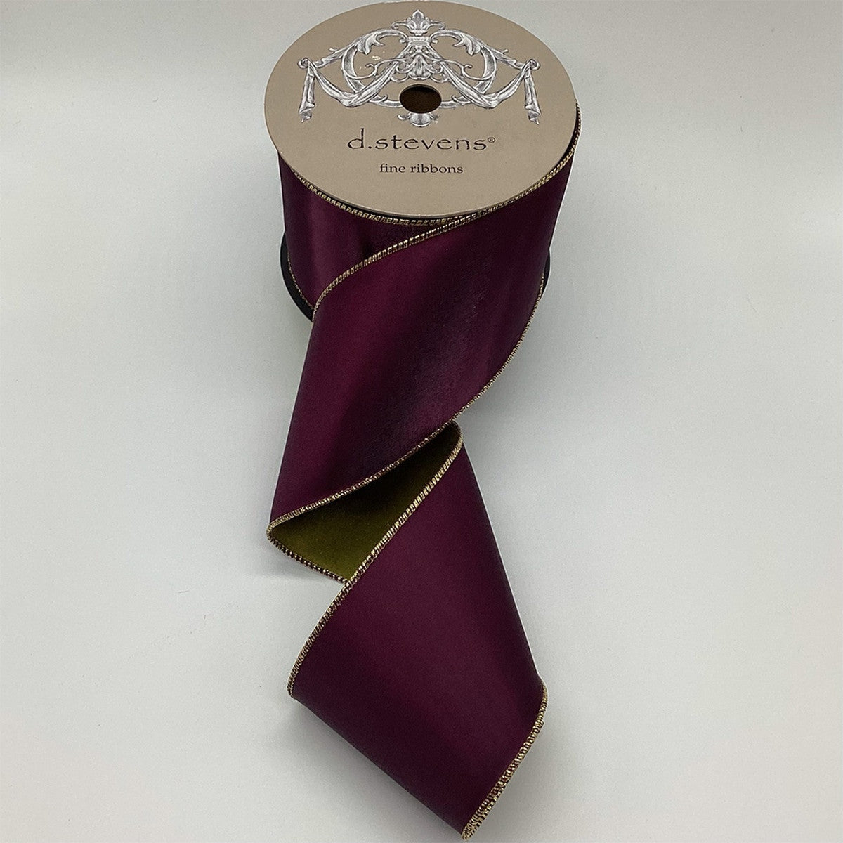 4 inch wide wine velvet ribbon with gold lamé backing on a d.stevens spool.