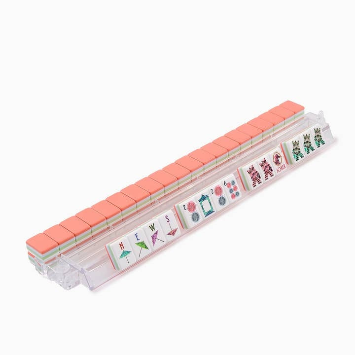 Solara Mahjong Tiles with pink backs and custom designs displayed on a clear acrylic rack.