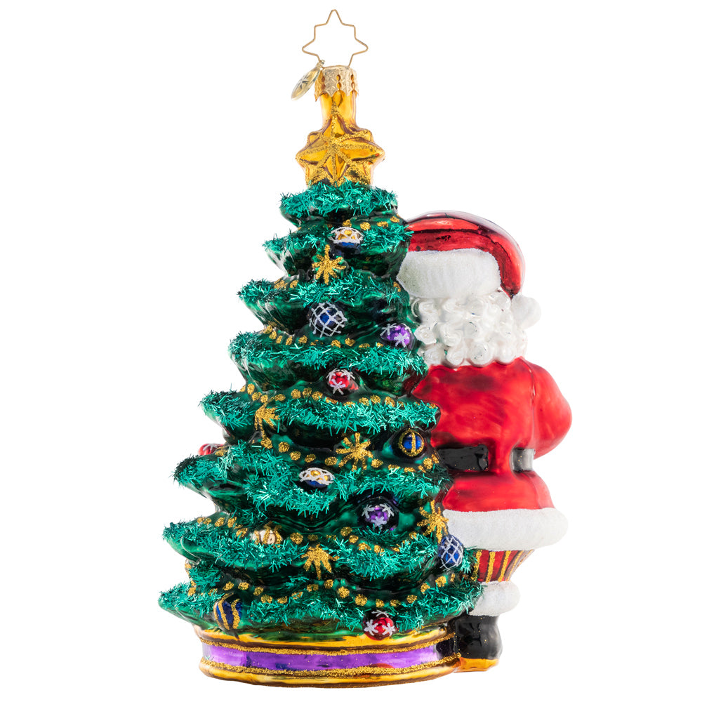 7-inch tall wooden Santa figurine with a red suit, white beard, black boots, and green holly accents.