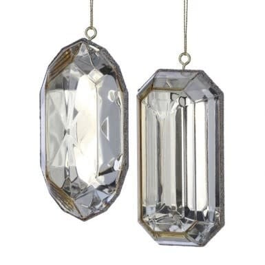 Two clear acrylic gem-shaped ornaments with faceted surfaces and metallic edges hanging on strings.