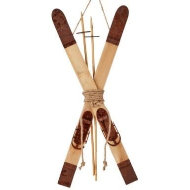 Metal winter ski pole ornament with a festive red and white striped pattern.