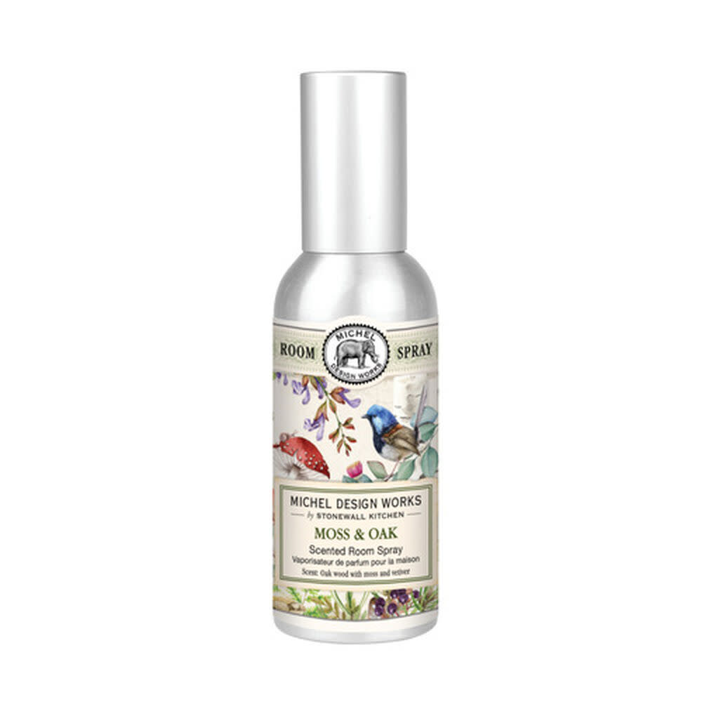Clear glass room spray bottle with white pump top containing light blue liquid.