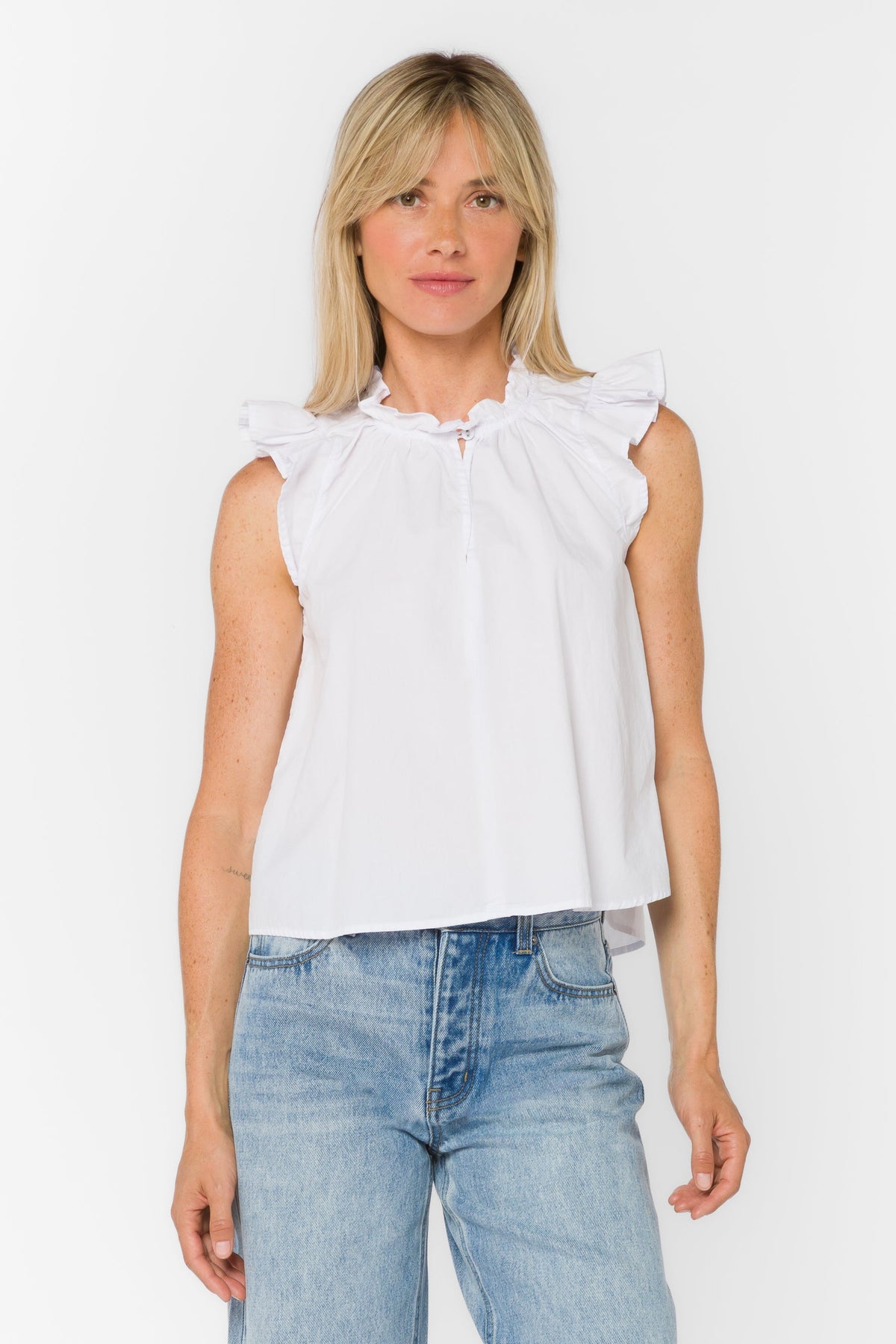 Black poplin sleeveless top with Mandarin collar, V-neckline, tie detail, and ruffle edge.