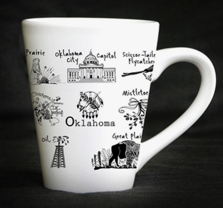White ceramic mug featuring an Oklahoma state outline in red with a blue background.