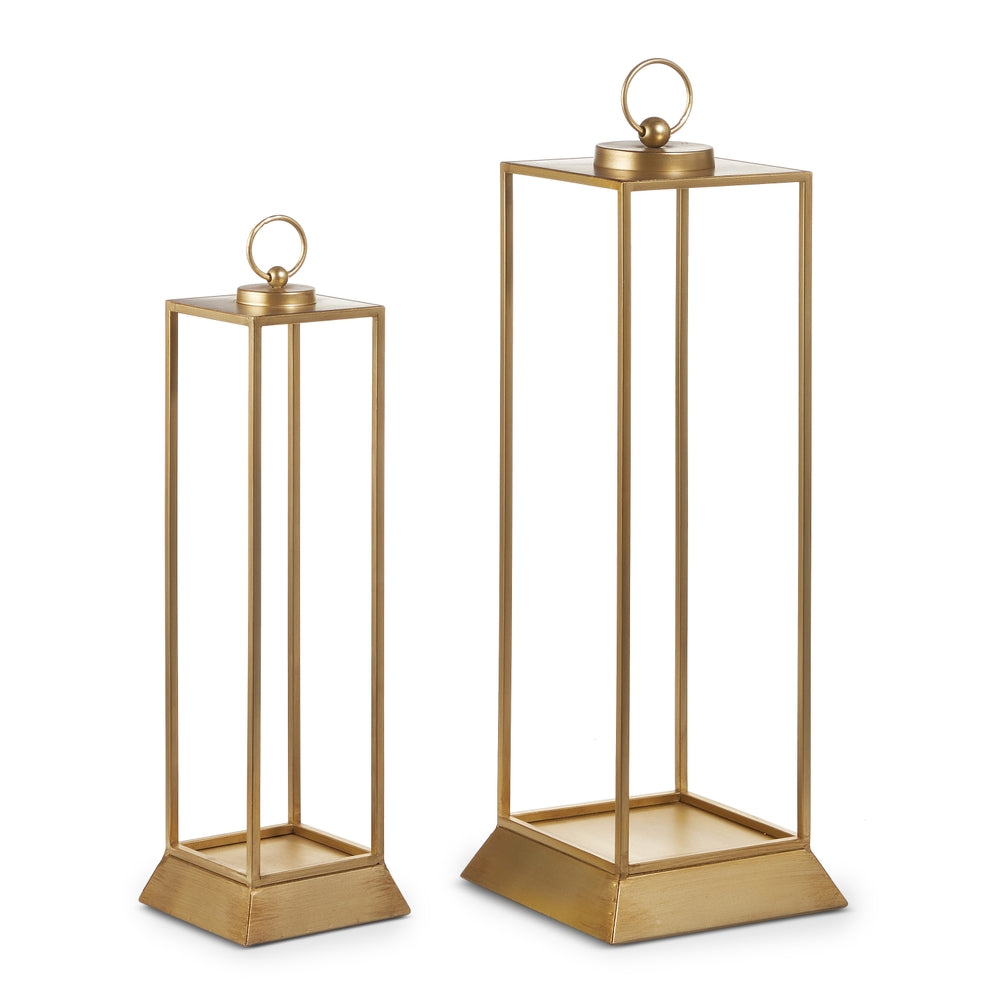 Tall gold iron lantern with delicate frame designed as decorative candle holder.