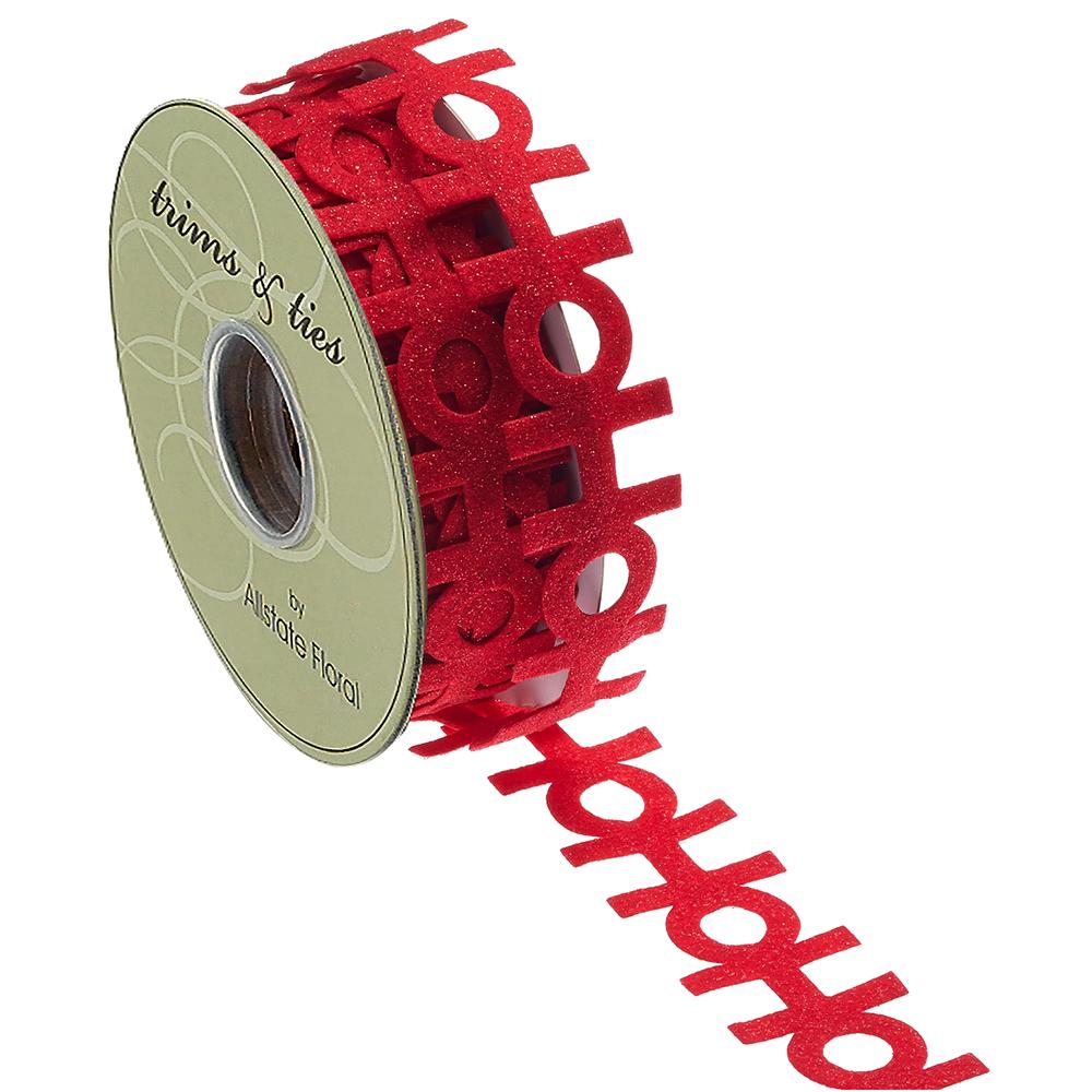 1.5 inch wide red glittery Ho Ho Ho pressed felt ribbon on a spool by Trims & Ties.