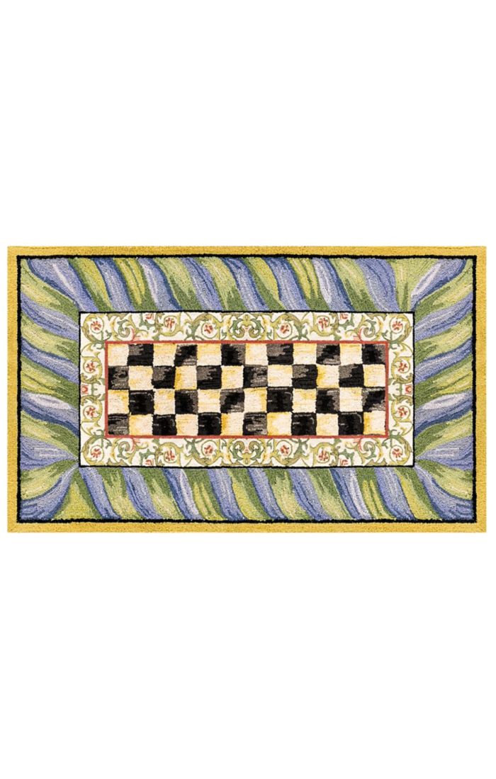 Purple and green checkered washable rug with a low pile height.