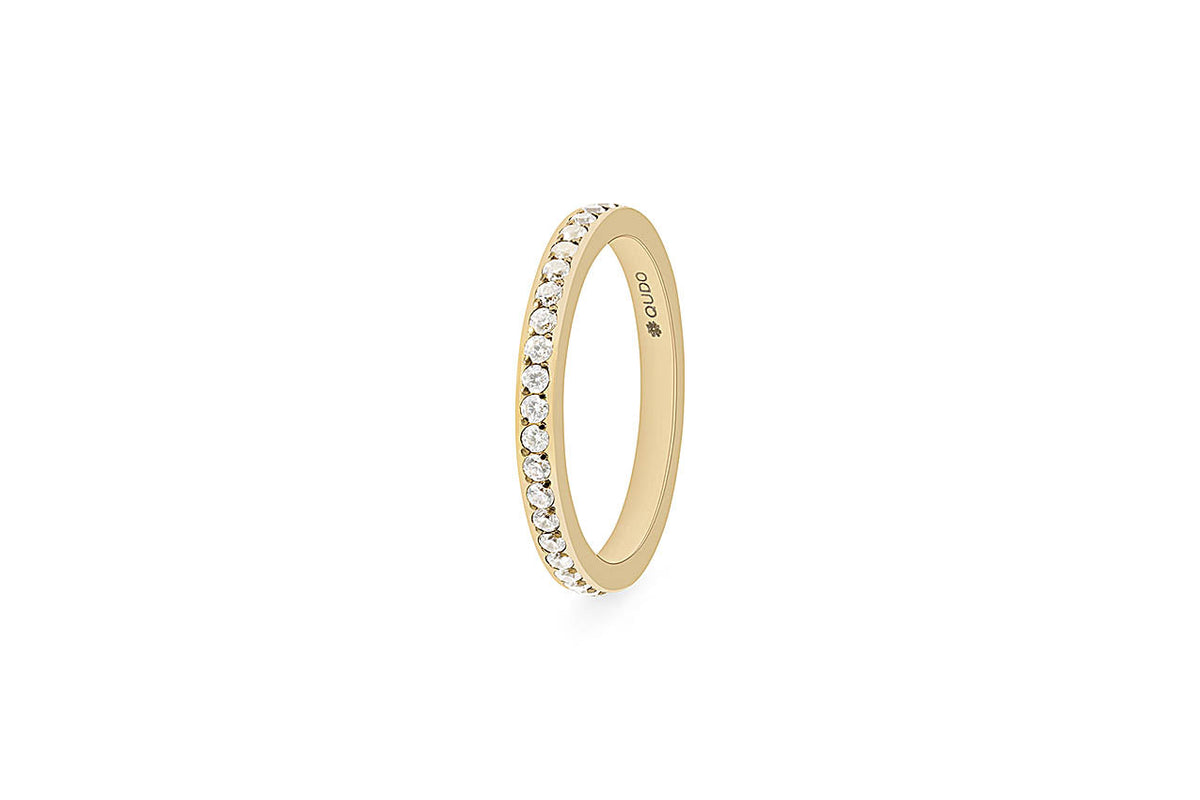 Small eternity ring with a continuous band of small spacer stones in silver metal.