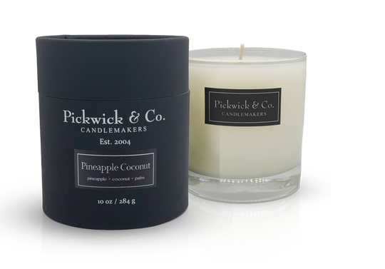 Pickwick candle in a clear glass jar with an off-white wax surface.