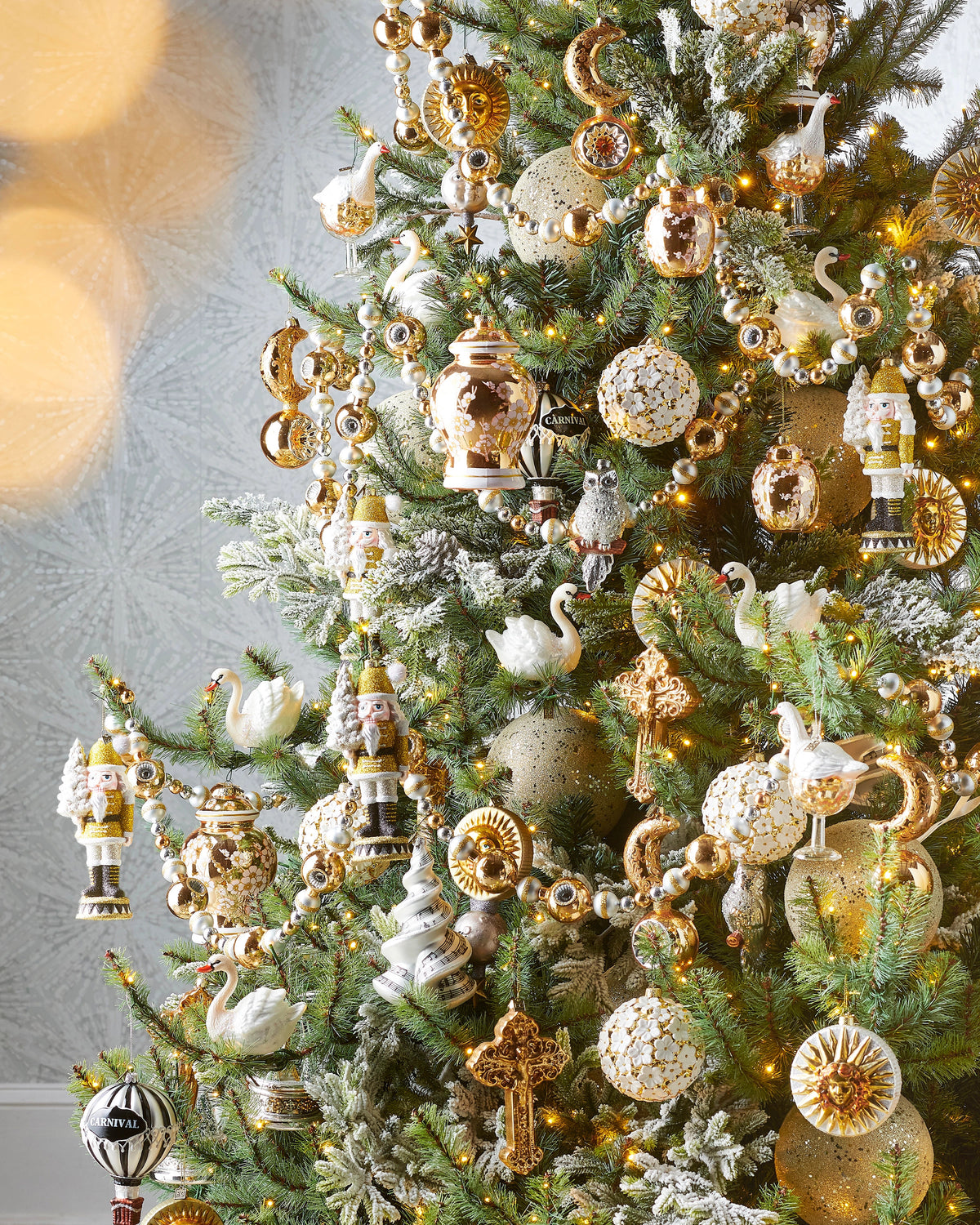 6' Gold, White, and Silver Reflector Garland draped on a decorated Christmas tree.