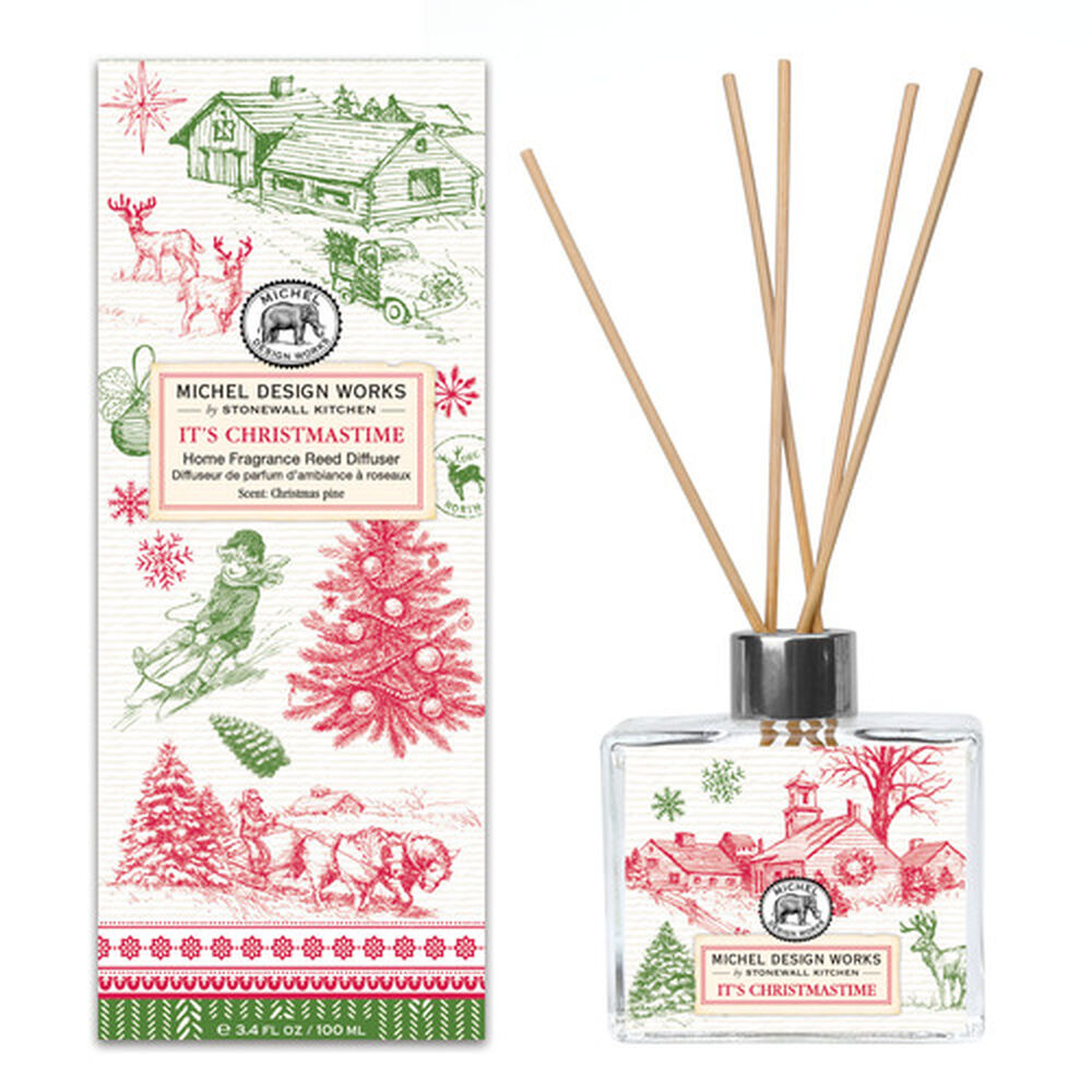 Home Fragrance Reed Diffuser with clear glass bottle containing light-colored liquid and multiple reed sticks.