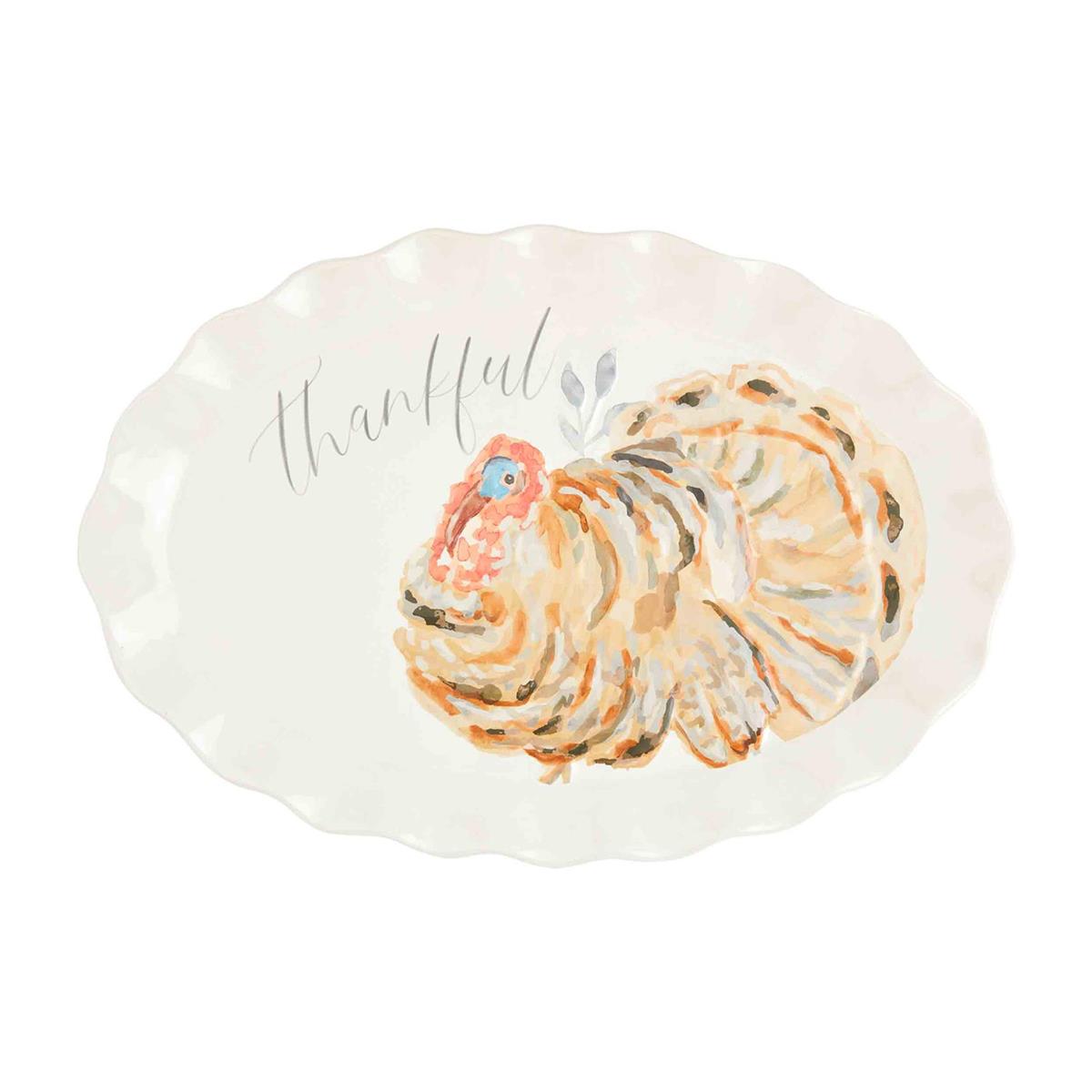 Stoneware Thanksgiving platter shaped like a turkey with brown glaze accents.