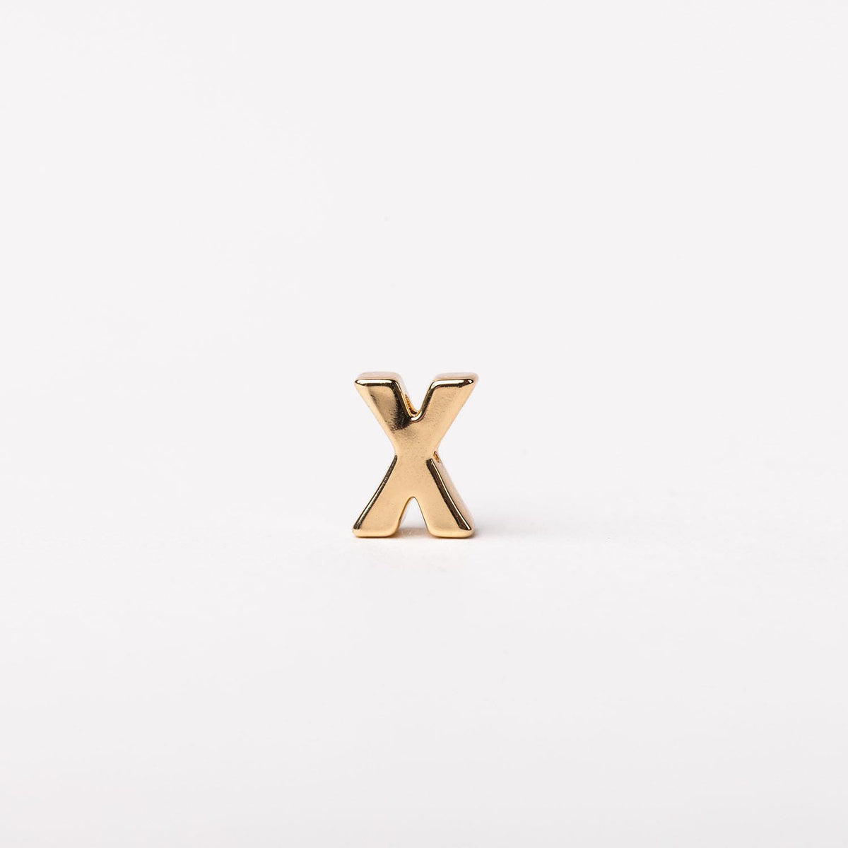 Gold-tone Charm Luxe bar necklace with a sleek rectangular pendant featuring subtle textured detailing.