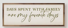 Rectangular wooden wall sign with white background and green text reading Days spent with family.