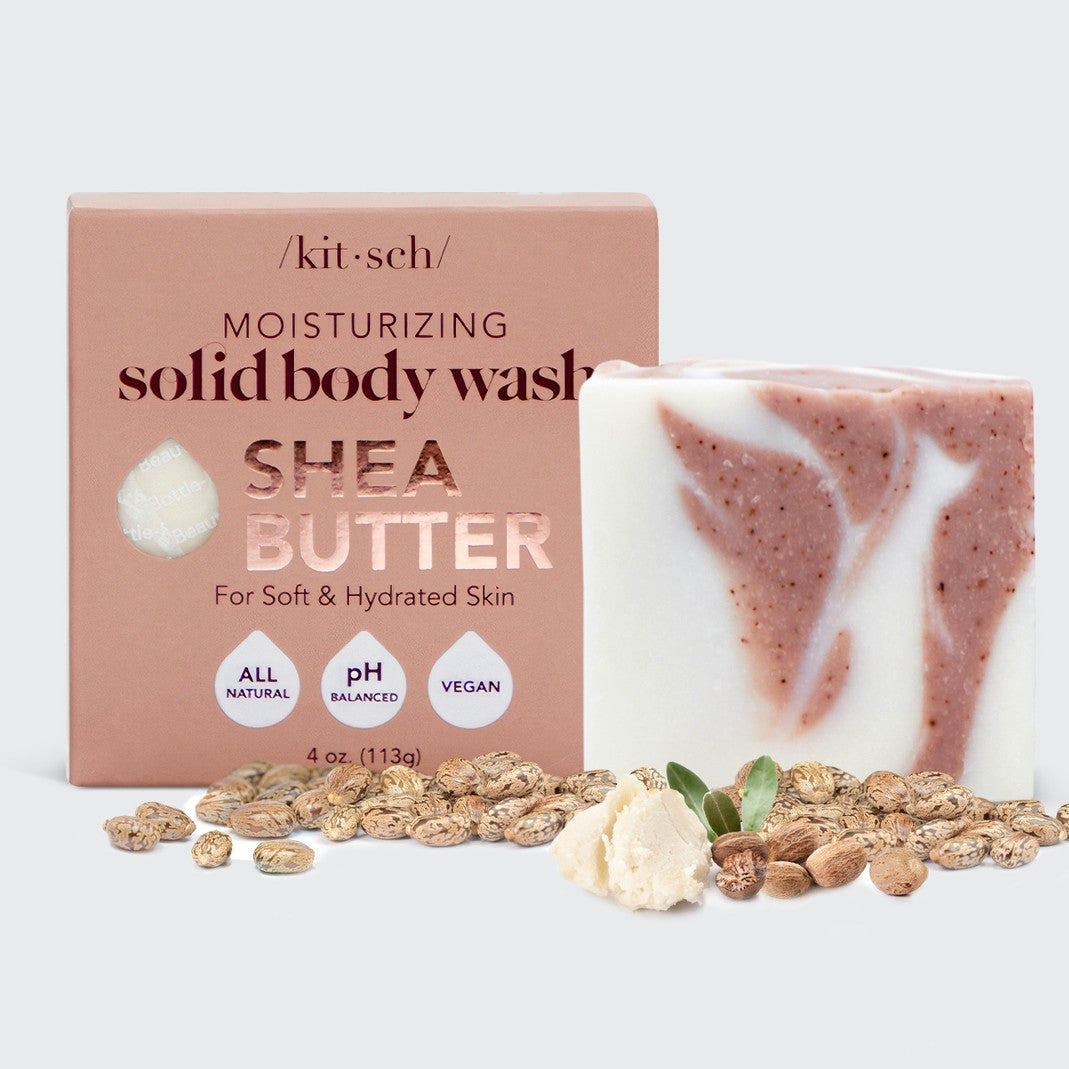 Kitsch Shea Butter Solid Body Wash Bar next to its box, with shea nuts and butter in the foreground.