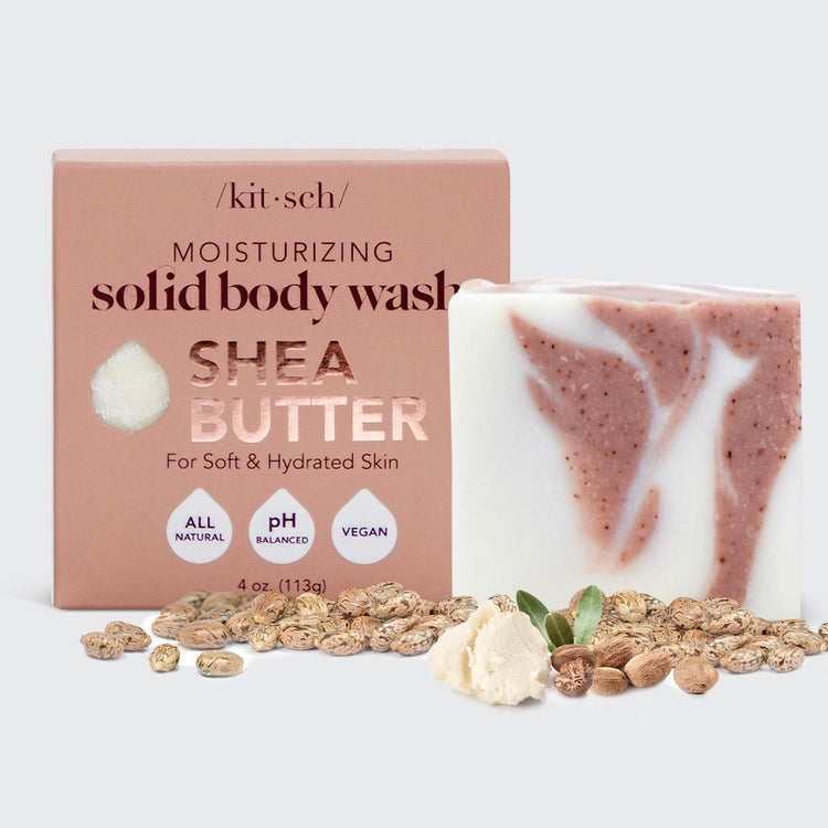 Kitsch Shea Butter Solid Body Wash Bar next to its box, with shea nuts and butter in the foreground.