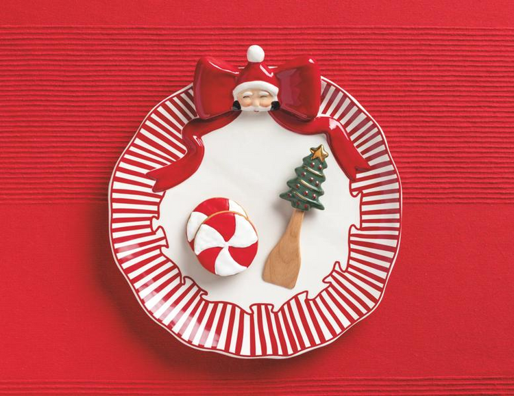 Santa Bow Cookie Plate set with a red and white striped ceramic plate and a tree-handle spatula.